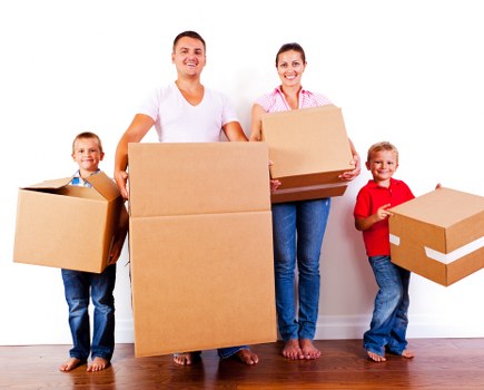 Packed boxes and furniture ready for home relocation