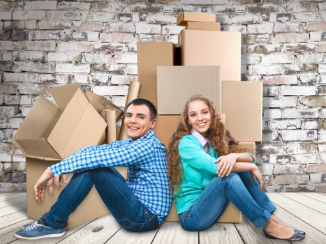 Packed moving boxes and furniture ready for a house move in Beckenham