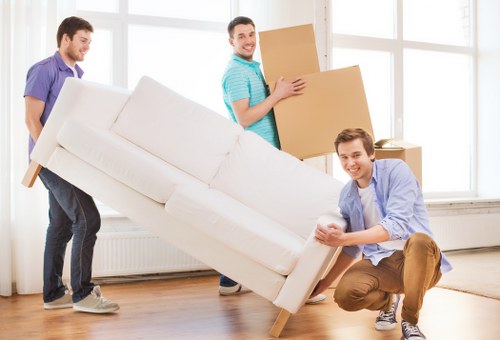 Careful loading of household items by movers in Beckenham