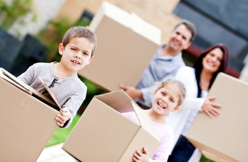 Packed moving boxes and furniture ready for loading in a Beckenham property