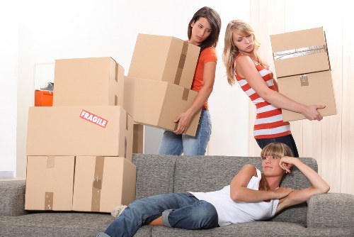 Moving crew loading household items for transport